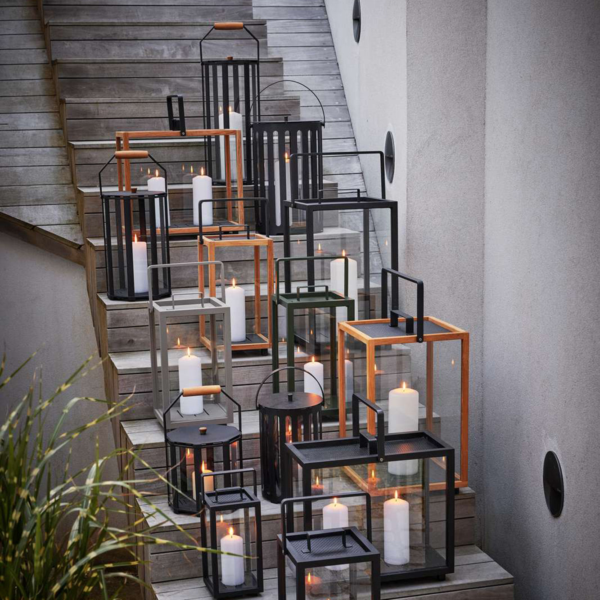 Lightlux Lantern with Teak Handle by Cane-Line, showing lightlux langerns with teak handle in live shot.