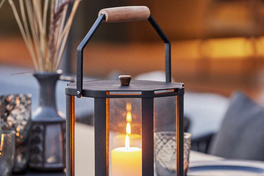 Lightlux Lantern with Teak Handle by Cane-Line, showing closeup view of lightlux langern with teak handle in live shot.