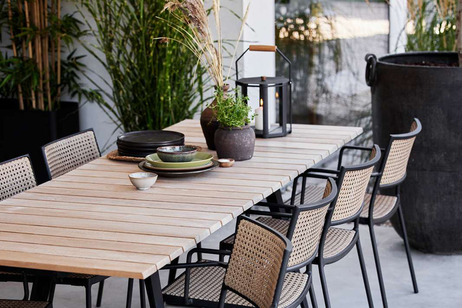 Lightlux Lantern with Teak Handle by Cane-Line, showing lightlux langern with teak handle in live shot.