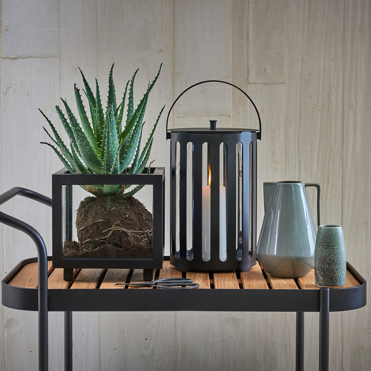 Lighttube Round Lantern by Cane-Line, showing lightube round lantern in live shot.