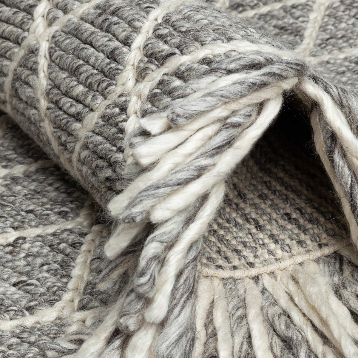 Merge 230.001.900 Hand Woven Rug by Ligne Pure, showing detail view of merge hand woven rug.