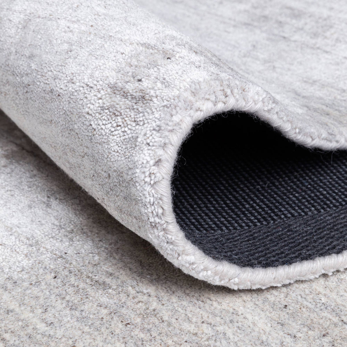 Ripple Hand Woven Rug by Ligne Pure, showing detail view of ripple hand woven rug.