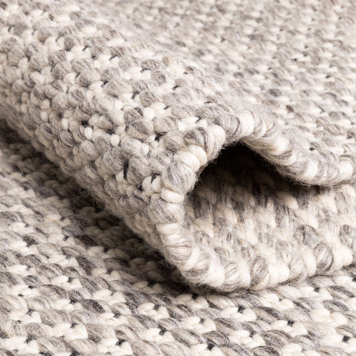 Solid 243.001.900 Hand Woven Rug by Ligne Pure, showing detail view of solid 243.001.900 hand woven rug.
