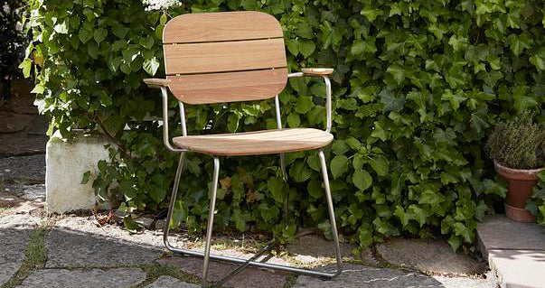 Lilium Teak Armchair by Skagerak, showing lilium teak armchair in live shot.