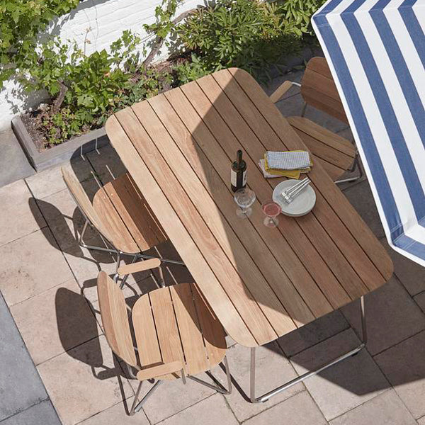 Lilium Teak Armchair by Skagerak, showing lilium teak armchairs in live shot.