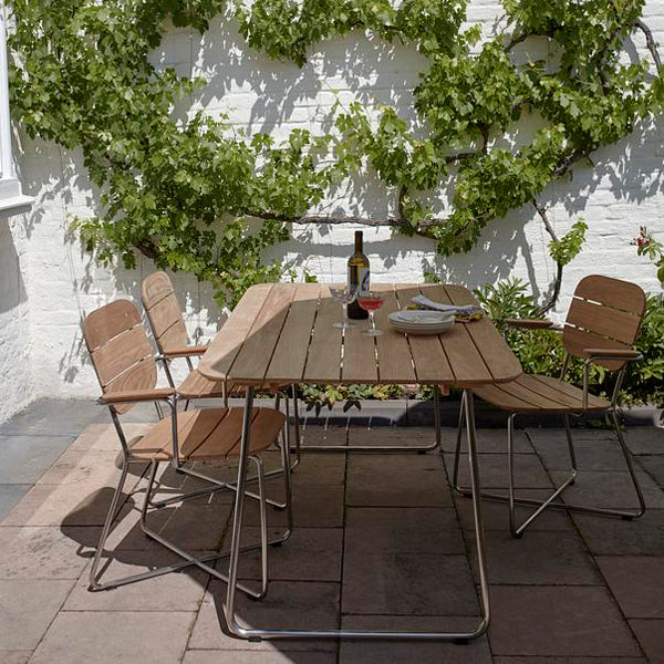 Lilium Teak Armchair by Skagerak, showing lilium teak armchairs in live shot.