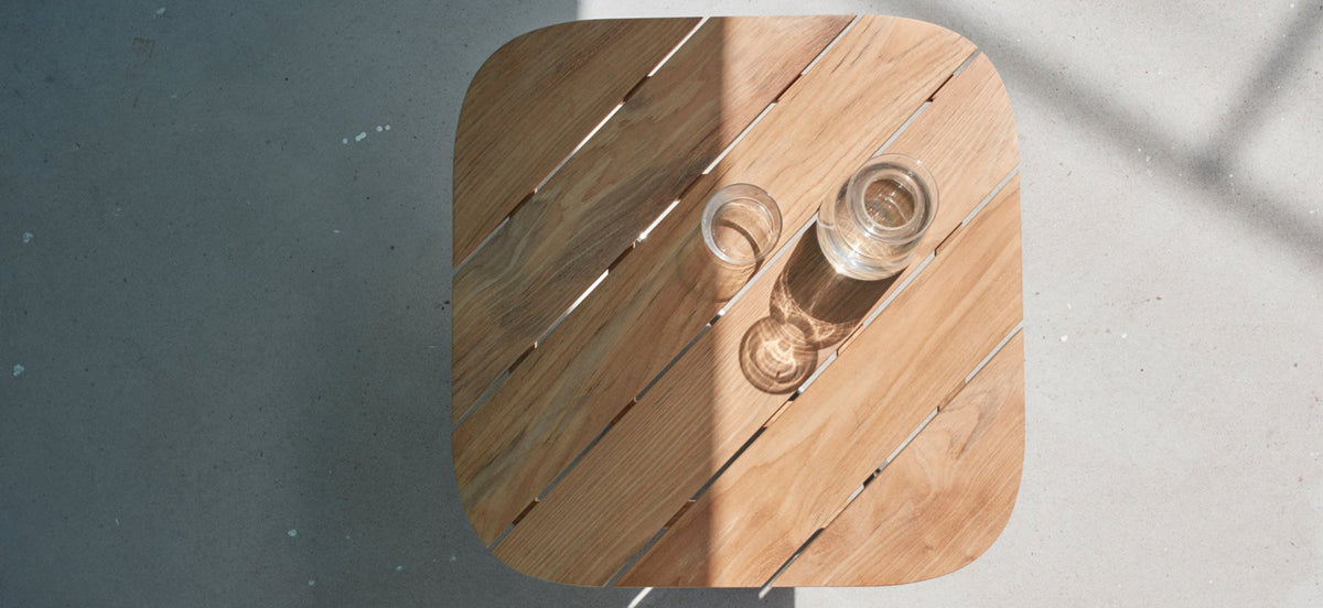 Lilium Teak Lounge Table by Skagerak, showing top view of lilium teak lounge table in live shot.