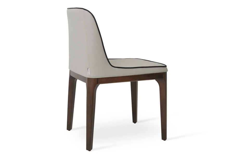 London Dining Chair by Sohoconcept, showing angle view of london dining chair in grey leatherette with black leatherette piping.