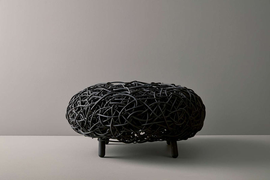 Loop Footstool by Cane-Line, showing loop footstool in live shot.