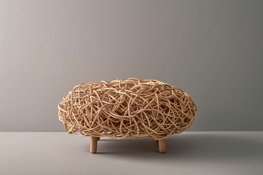 Loop Footstool by Cane-Line, showing loop footstool in live shot.