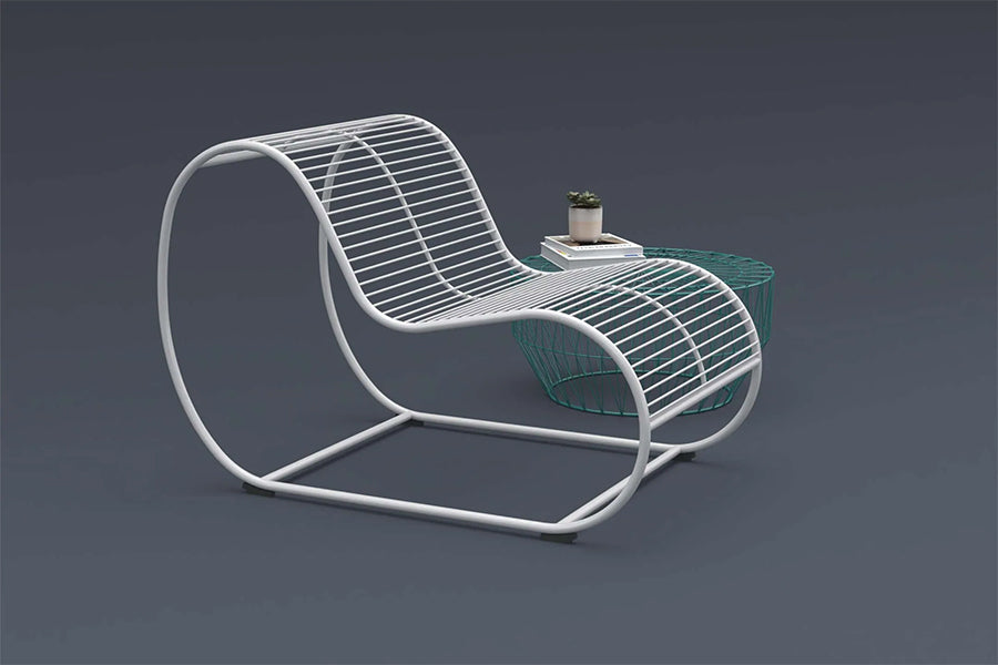 Loop Lounge Chair by Bend, showing closeup view of loop lounge chair with side table in live shot.