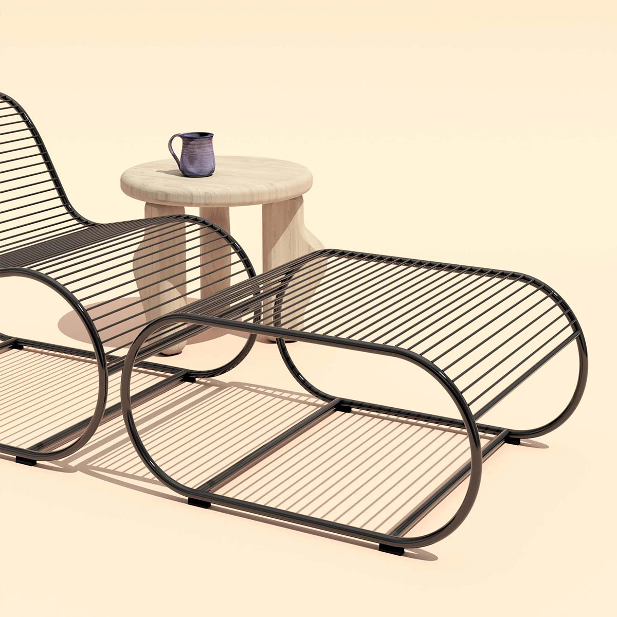 Loop Ottoman by Bend, showing loop ottoman with lounge chair & side table in live shot.