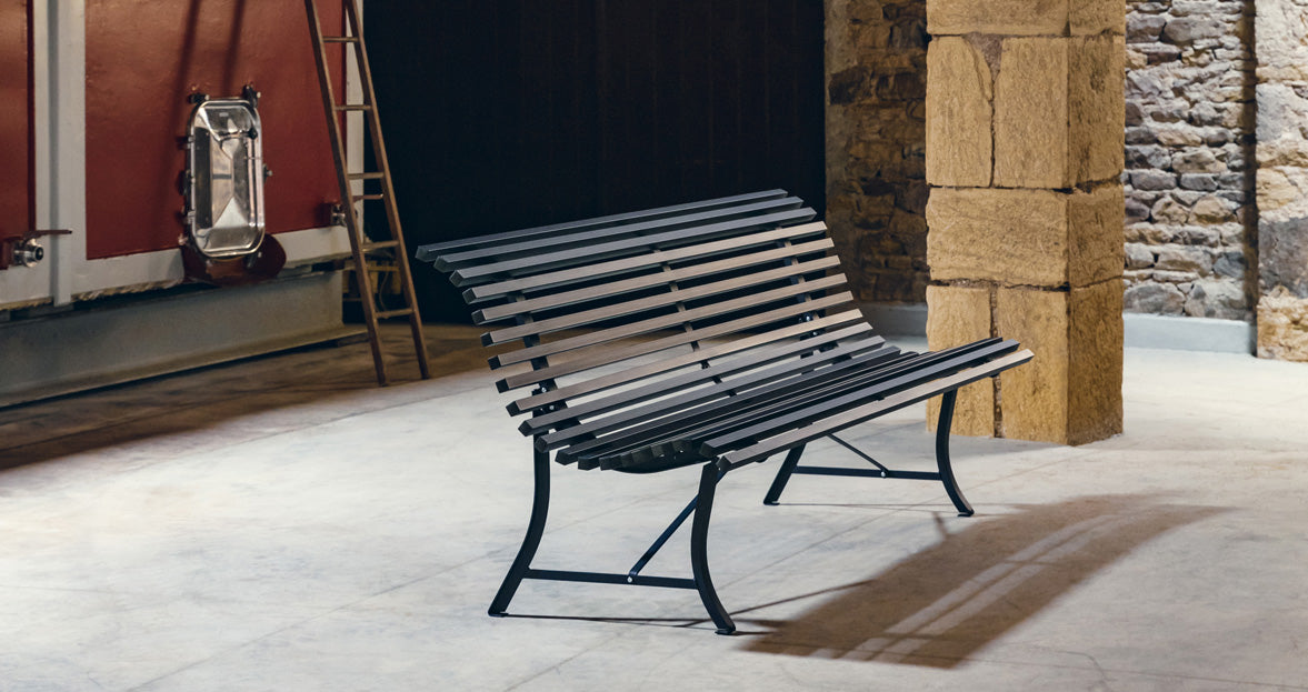 Louisiane Bench by Fermob, showing side veiw of louisiane bench in the live shot.