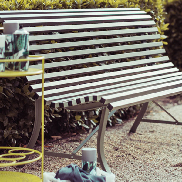 Louisiane Bench by Fermob, showing angle veiw of louisiane bench in the live shot.