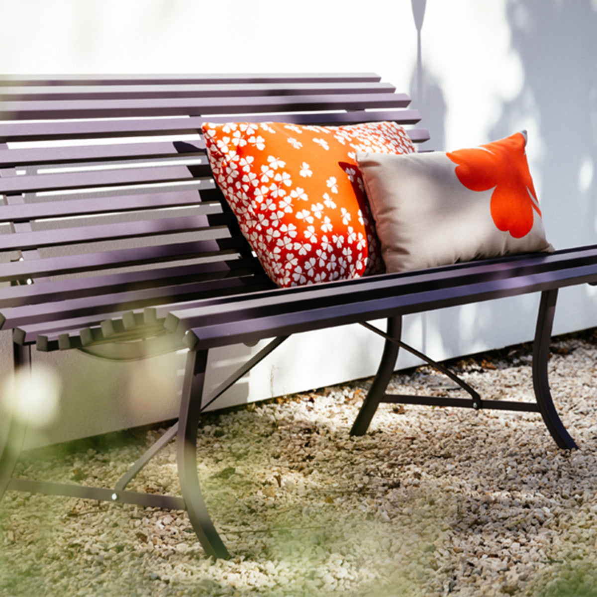 Louisiane Bench by Fermob, showing angle veiw of louisiane bench in the live shot.