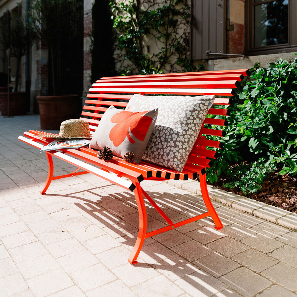 Louisiane Bench by Fermob, showing angle veiw of louisiane bench in the live shot.