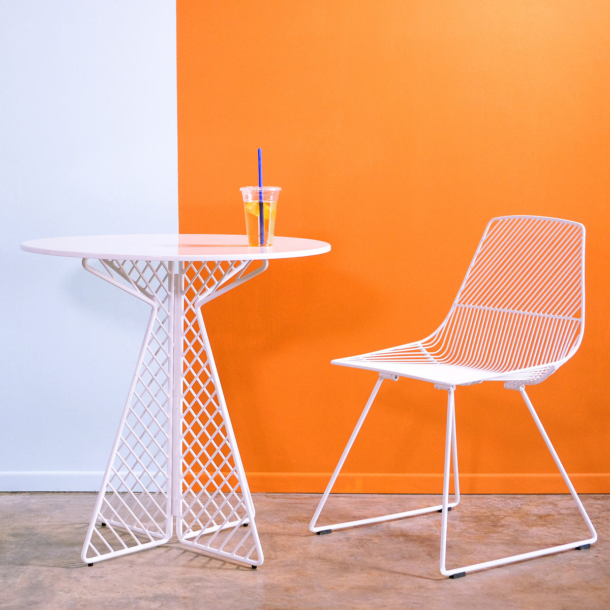 Lucy Side Dining Chair by Bend, showing lucy side dining chair with table in live shot.