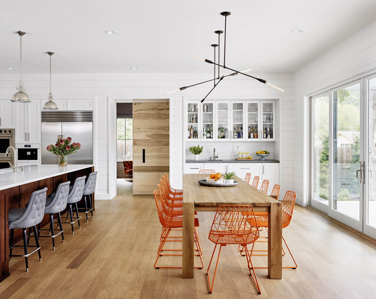Lucy Side Dining Chair by Bend, showing lucy side dining chairs with table in live shot.