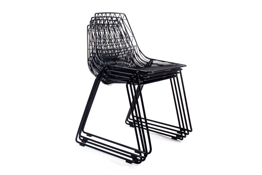 Lucy Stacking Chair by Bend, showing angle view of lucy stacking chairs in peacock black(pair) without seatpads.