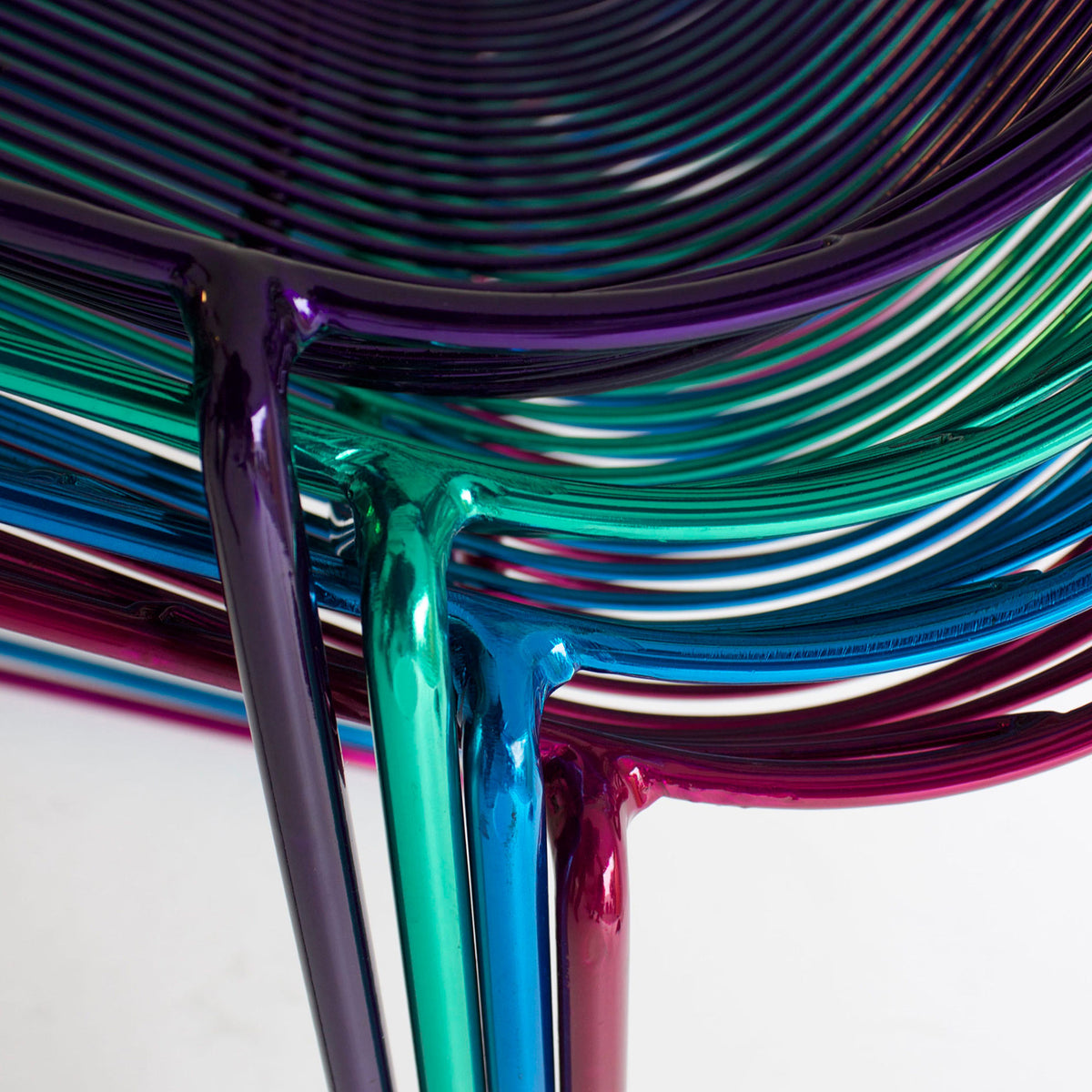 Lucy Stacking Chair by Bend, showing closeup view of lucy stacking chairs in live shot.