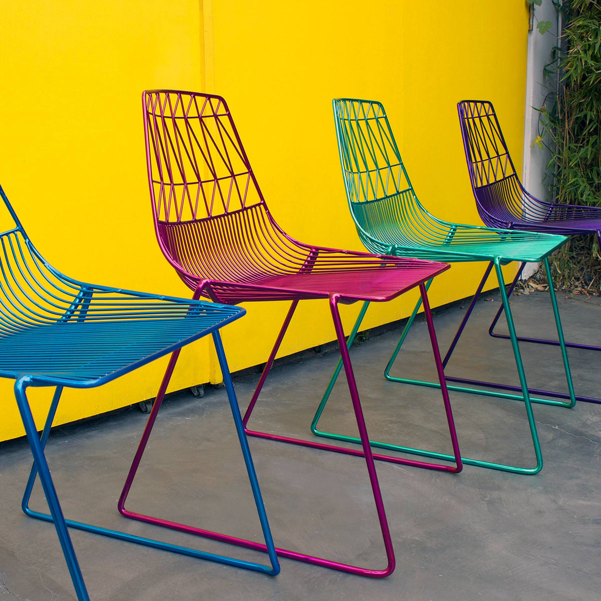 Lucy Stacking Chair by Bend, showing lucy stacking chairs in live shot.