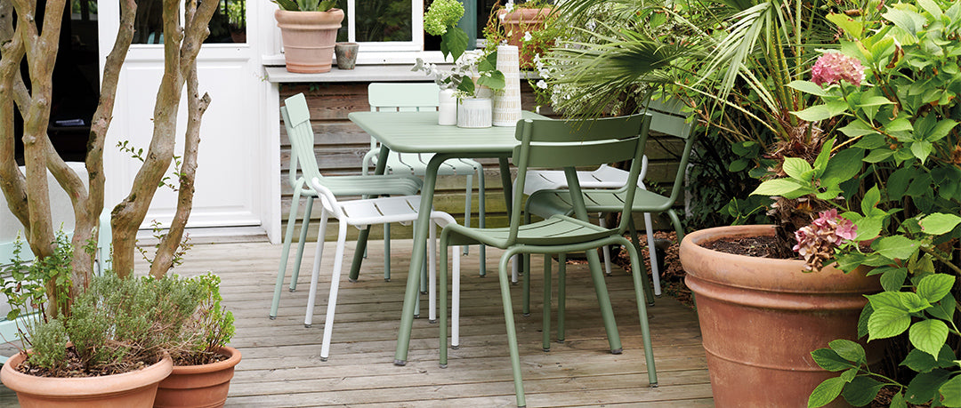 Luxembourg Stool by Fermob, showing luxembourg 19" stool with chairs and table in live shot.