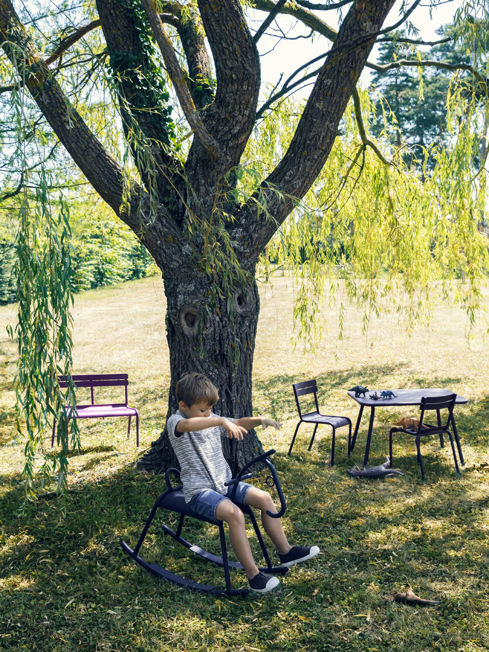 Luxembourg 2 Seater Bench by Fermob, showing of bench with chair in the live shot.