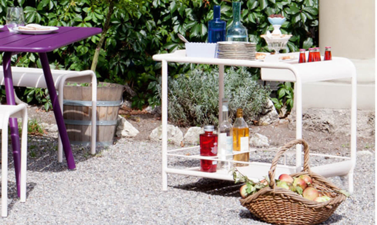 Luxembourg Bar Cart with Wheels by Fermob, showing bar with wheels in live shot.