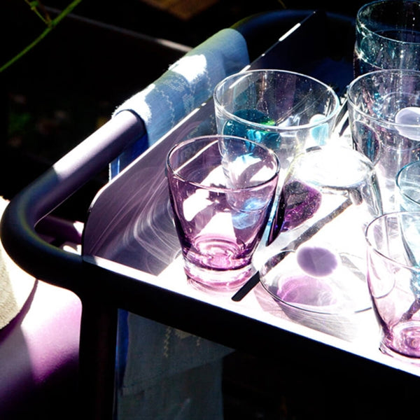 Luxembourg Bar Cart with Wheels by Fermob, showing closeup view of bar with wheels in live shot.