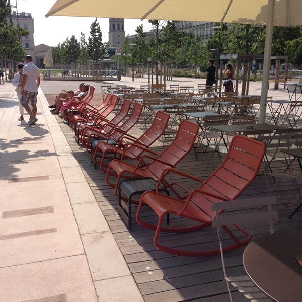 Luxembourg Rocking Chair by Fermob, showing rocking chair with low tables & tables in live shot