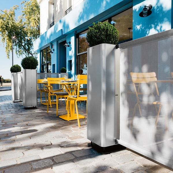 Luxembourg Stacking Side Chair by Fermob, showing side chairs with tables in live shot.