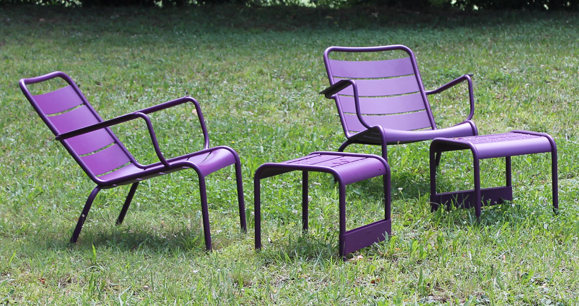 Luxembourg Small Low Table / Footrest by Fermob, showing angle view of low table with chairs in the live shot.