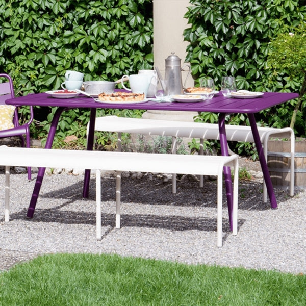 Luxembourg Rectangular Table by Fermob, showing rectanle tables 56" x 40" with chairs in live shot.