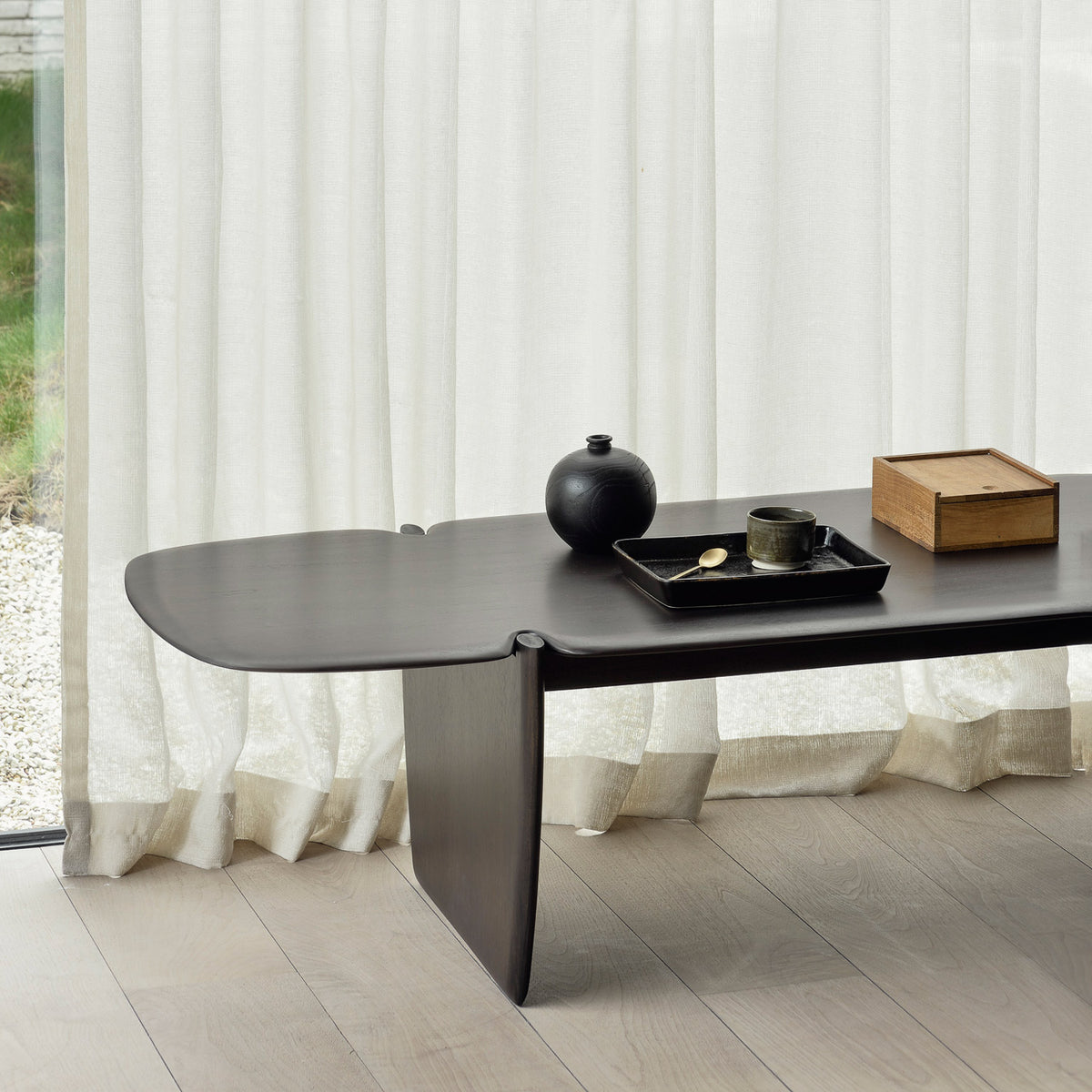 PI Coffee Table by Ethnicraft, showing closeup view of pi coffee table in live shot.