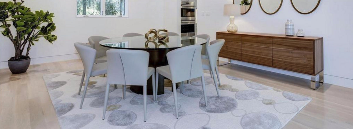 Malta Sideboard by SohoConcept, showing angle view of sideboard with table and chairs in live shot.