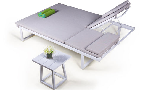 Allux Double Lounger by Mamagreen, showing allux double lounger with cushions and side table in live shot.