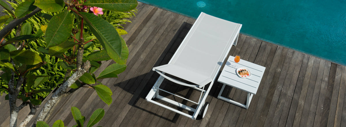 Allux Side Table by Mamagreen, showing medium side table and allux lounger in live shot.