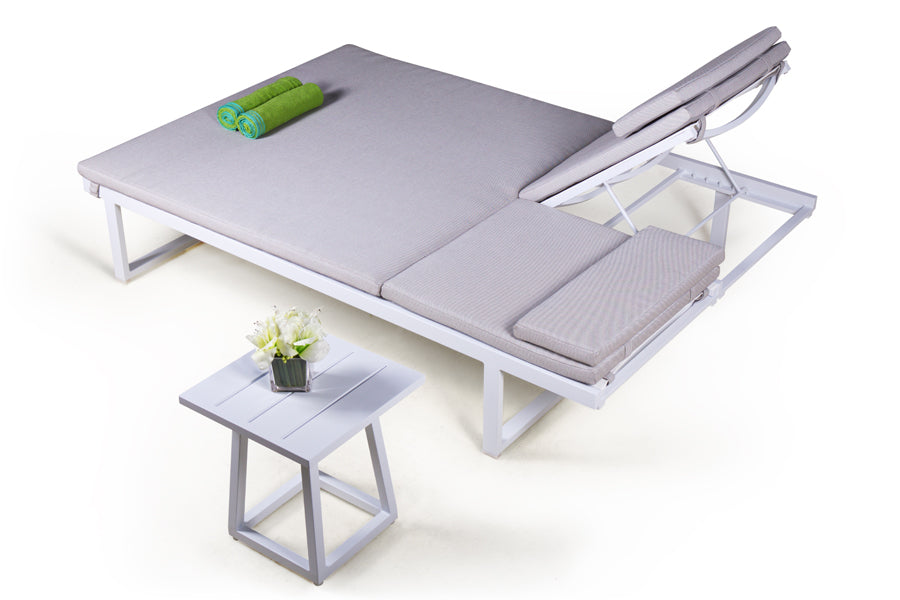 Allux Side Table by Mamagreen, showing small side table and allux lounger in live shot.