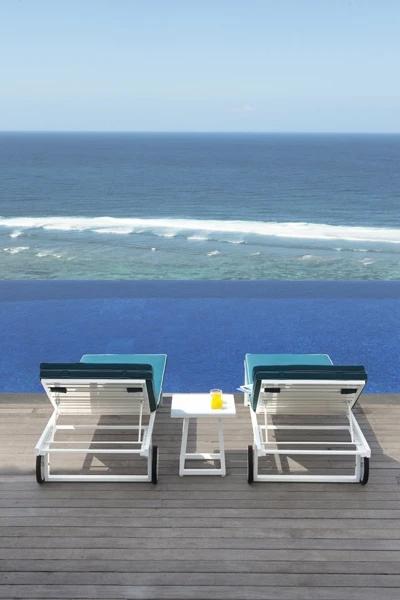 Allux Side Table by Mamagreen, showing side table and lounger in live shot.