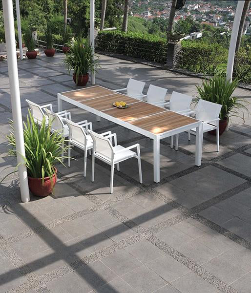 Allux Stacking Armchair by Mamagreen, showing stackable armchairs and dining table in live shot.
