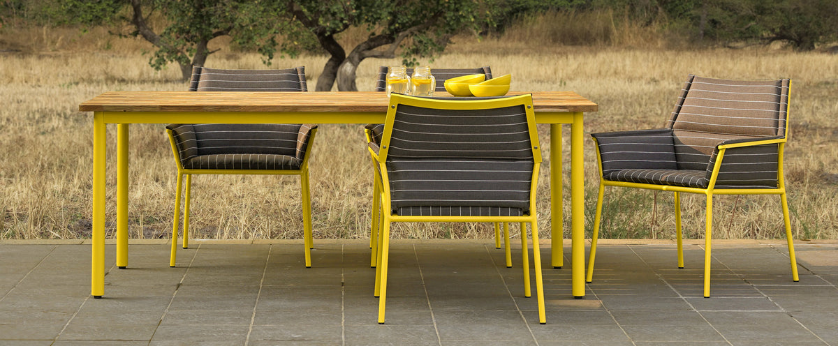 Andy Dining Chair by Mamagreen, showing andy dining chairs with dining table in live shot.