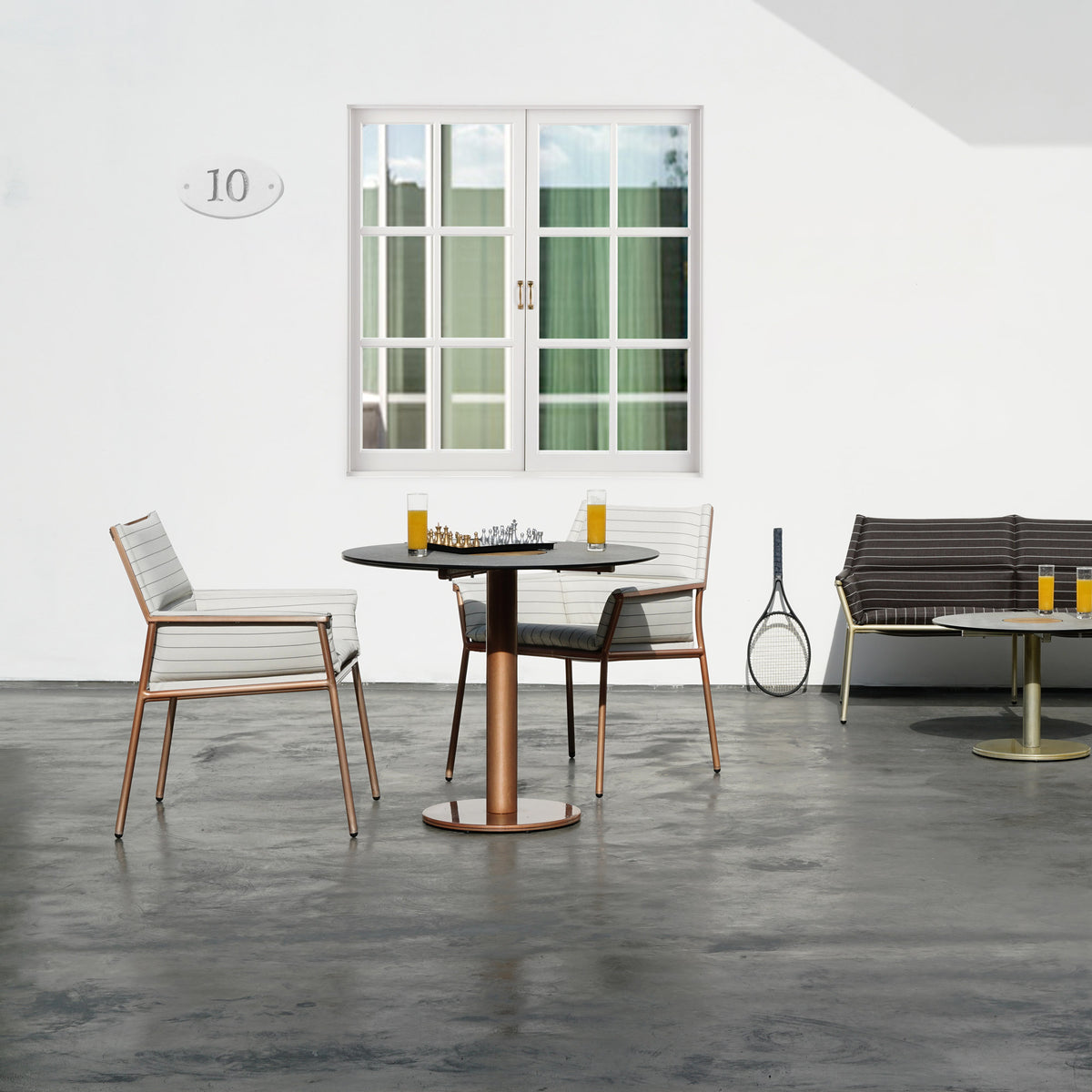Andy Dining Chair by Mamagreen, showing andy dining chairs with dining table in live shot.