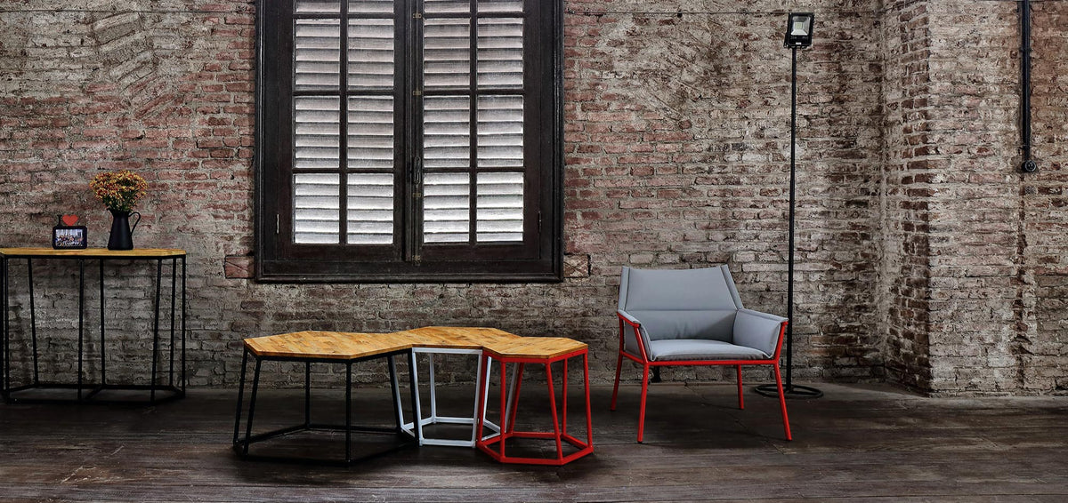 Andy Easy Chair by Mamagreen, showing andy easy chair with polygon stools in live shot.