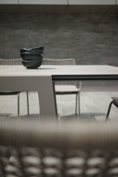 Baia HPL Aluminum Extendable 67" Dining Table by Mamagreen, showing closeup view of baia hpl aluminum extendable 67" dining table in live shot.