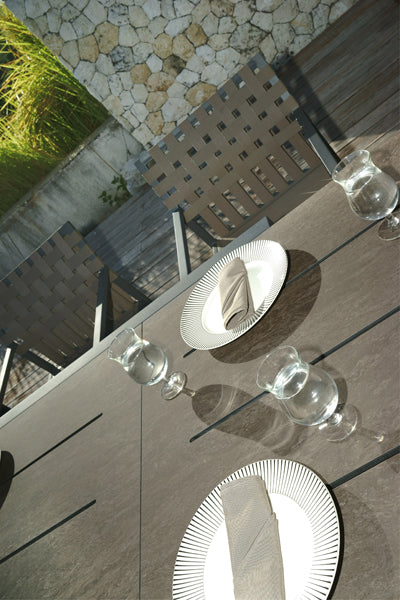 Baia HPL Aluminum Extendable 90.5" Dining Table by Mamagreen, showing closeup view of baia hpl aluminum extendable 90.5" dining table in live shot.