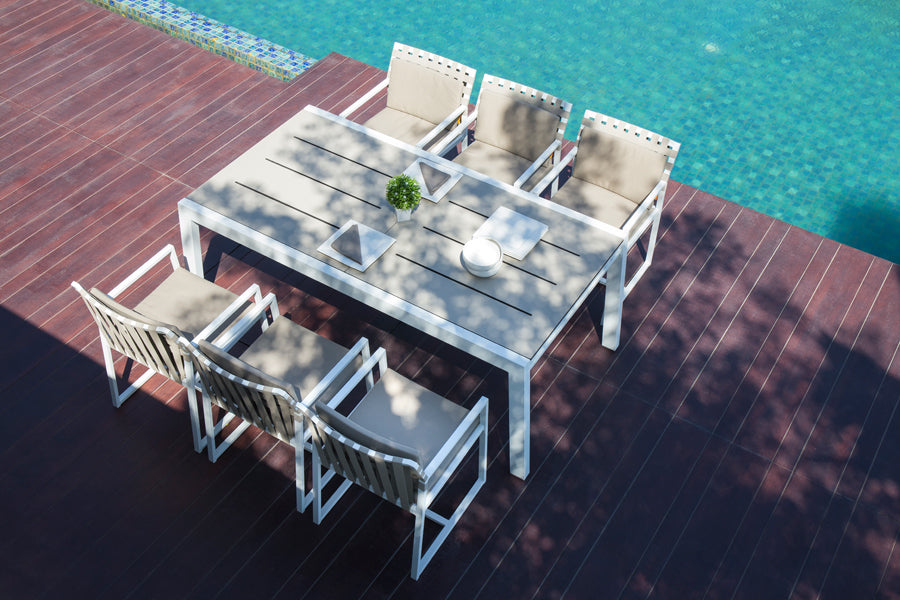 Baia HPL Aluminum Extendable 90.5" Dining Table by Mamagreen, showing baia hpl aluminum extendable 90.5" dining table(closed) with ekka carver chair in live shot.