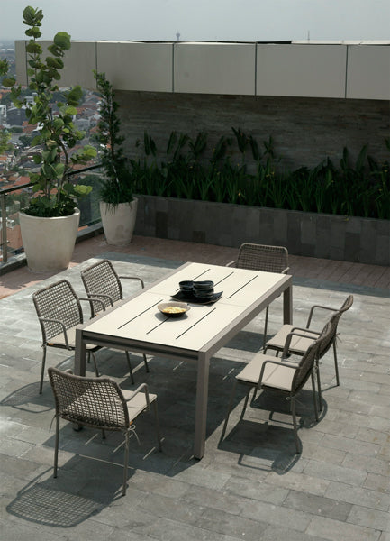 Baia HPL Aluminum Extendable 90.5" Dining Table by Mamagreen, showing baia hpl aluminum extendable 90.5" dining table with anda chair woven aluminum in live shot.