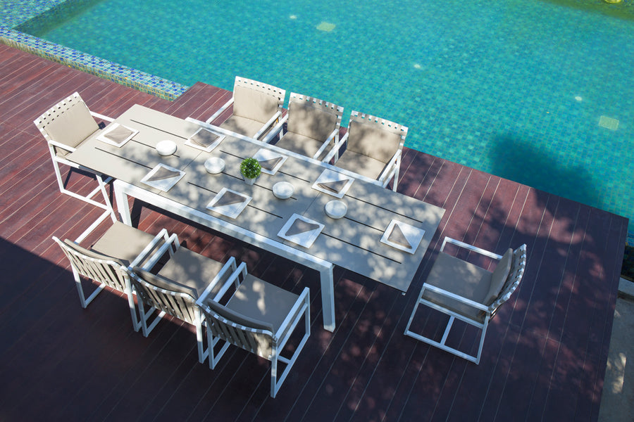 Baia HPL Aluminum Extendable 90.5" Dining Table by Mamagreen, showing baia hpl aluminum extendable 90.5" dining table(extended) with ekka carver chair in live shot.