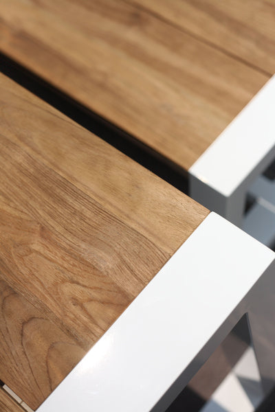 Baia Teak Aluminum Extendable Dining Table by Mamagreen, showing closeup view of baia teak aluminum extendable dining table in live shot.
