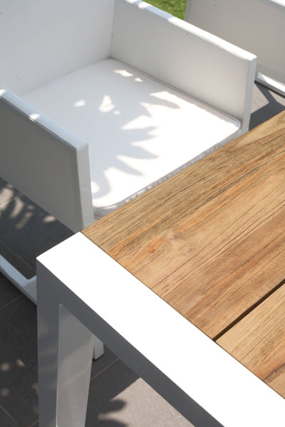 Baia Teak Aluminum Extendable Dining Table by Mamagreen, showing closeup view of baia teak aluminum extendable dining table in live shot.